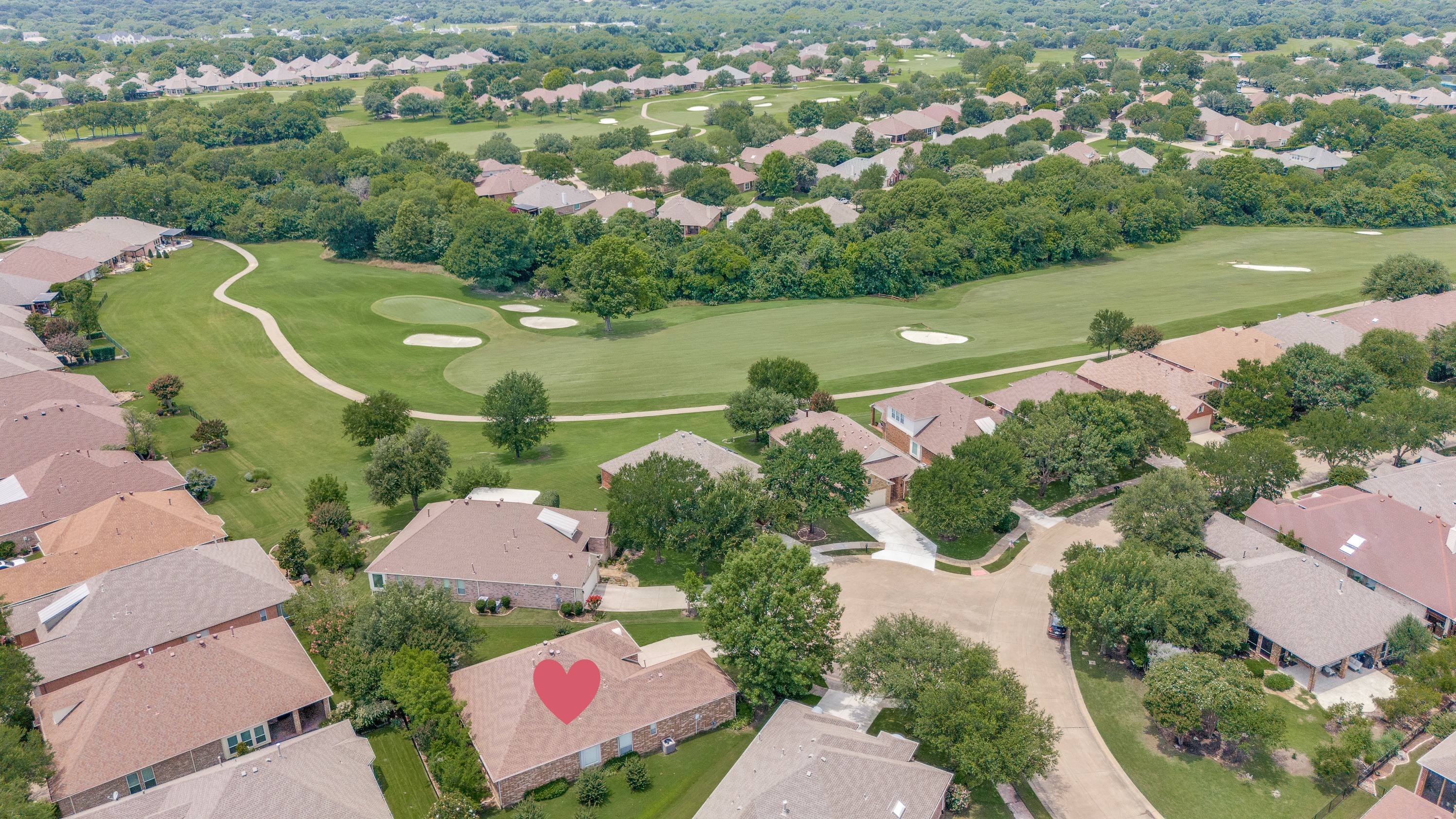 Aerial view of 351 Southern Hills Dr backing to the Heritage Ranch golf course in Fairview, TX